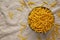 Dry Organic Maccheroni Pasta in a Bowl, top view. Flat lay, overhead, from above. Copy space