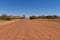 dry path of sand in the australian outback ends in the desert