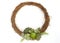 Dry rattan wreath garland with green and red succulent arrangement white background