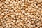 Dry raw organic chickpeas background. Top view