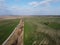 Dry reclamation canal in the field, aerial view. Agricultural landscape