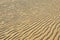 Dry rippled golden sand, ideal for backgrounds