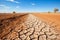 Dry river bed among parched terrain. Effects of climate change, desertification and droughts