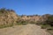 Dry river bed with sandy cliffs