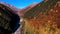 Dry river in mountain valley in autumn. Footage. Top view of beautiful mountain landscape with river valley and colorful