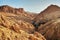 Dry rocks in desert, lit by midday sun. Chebika oasis