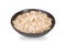 Dry rolled oat flakes oatmeal in bowl