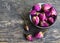 Dry rose buds flowers in a bowl on old wooden table.Healthy herbal drinks concept.Asian ingredient for aromatherapy tea.