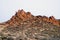 The dry rugged red colored rock boulders