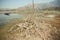 Dry soil around salt lake Bafa with fishermen boats, Turkey.