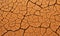 Dry soil orange surface cracked ground texture background. orange dry soil detail vector