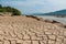 Dry soil texture pattern inside the drying riverbed