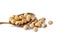 Dry soy bean in brass spoon on white