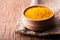 Dry spice turmeric in a wooden bowl close-up