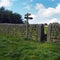 dry stone wall and walking sign in english countryside