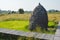 Dry straw stacking on paddy field at Thailand countryside in sunny day