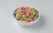 Dry sugar coated fruity flavored cereal in a bowl