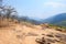 Dry tree and hay on the mountain or cliff have sand and rock with blue sky at Op Luang National Park, Hot, Chiang Mai, Thailand