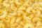 Dry uncooked cavatappi italian pasta full background.