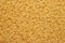 Dry uncooked macaroni texture background