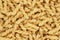 Dry uncooked thick gemelli pasta texture