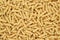 Dry uncooked thick gemelli pasta texture
