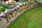 The dry wall serves as a terrace terrace for the garden, where it holds a mass of soil. the wall is slightly curved, which helps i