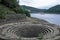 Dry well and banks at Lady Bower reservoir in late summer.