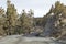 Dry Winding Gravel Road With Juniper Trees