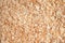 Dry wood shavings background texture. Wood dust. Sawdust pattern closeup. Sawdust detail floor texture. Top view flat layout