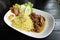 Dry Yellow Noodles with egg, salad, sausage and braised pork