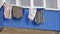 Drying clothes hanging on a balcony of the house