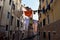 Drying clothes hanging on a string between the two facades of a building on a canal in Venice