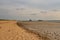 Drying field during drought under a cloudy sky