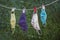 Drying outside re-usable family face masks, hang on a clothesline nylon rope with clothespins