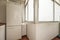 Drying terrace of a house with a white refrigerator in a corner