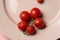 Drying tomatoes on a dinner plate