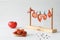 Drying tomatoes on a rope with clothespins and pepper