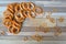 Drying wheat flour close up.  Frame of big and small bagels on wooden shabby table. Russian food