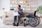 Dsabled businessman on wheelchair working home