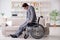 Dsabled businessman on wheelchair working home