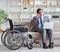 Dsabled businessman on wheelchair working home