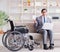 Dsabled businessman on wheelchair working home