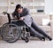 Dsabled businessman on wheelchair working home
