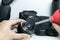DSLR camera lens cleaning by blowing dust of the lens