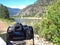 A DSLR Taking a Photo of a Wide Mountain River