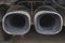 dual car exhaust pipe covered in soot