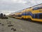 Dual Deck Passenger train carriages lined up on tracks for recycling at Amsterdam Marine Terminal.