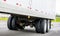 Dual wheels trailer axles on the running on the road dry van semi trailer with cargo