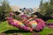 Dubai Butterfly Garden entrance way of floral design to sign of nature tourist attraction on sunny day